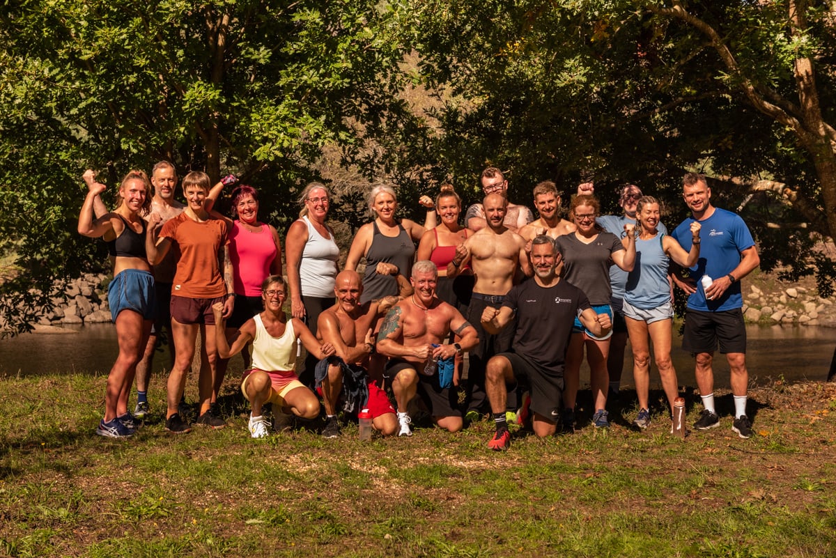 A group photo of people after an outdoor workout